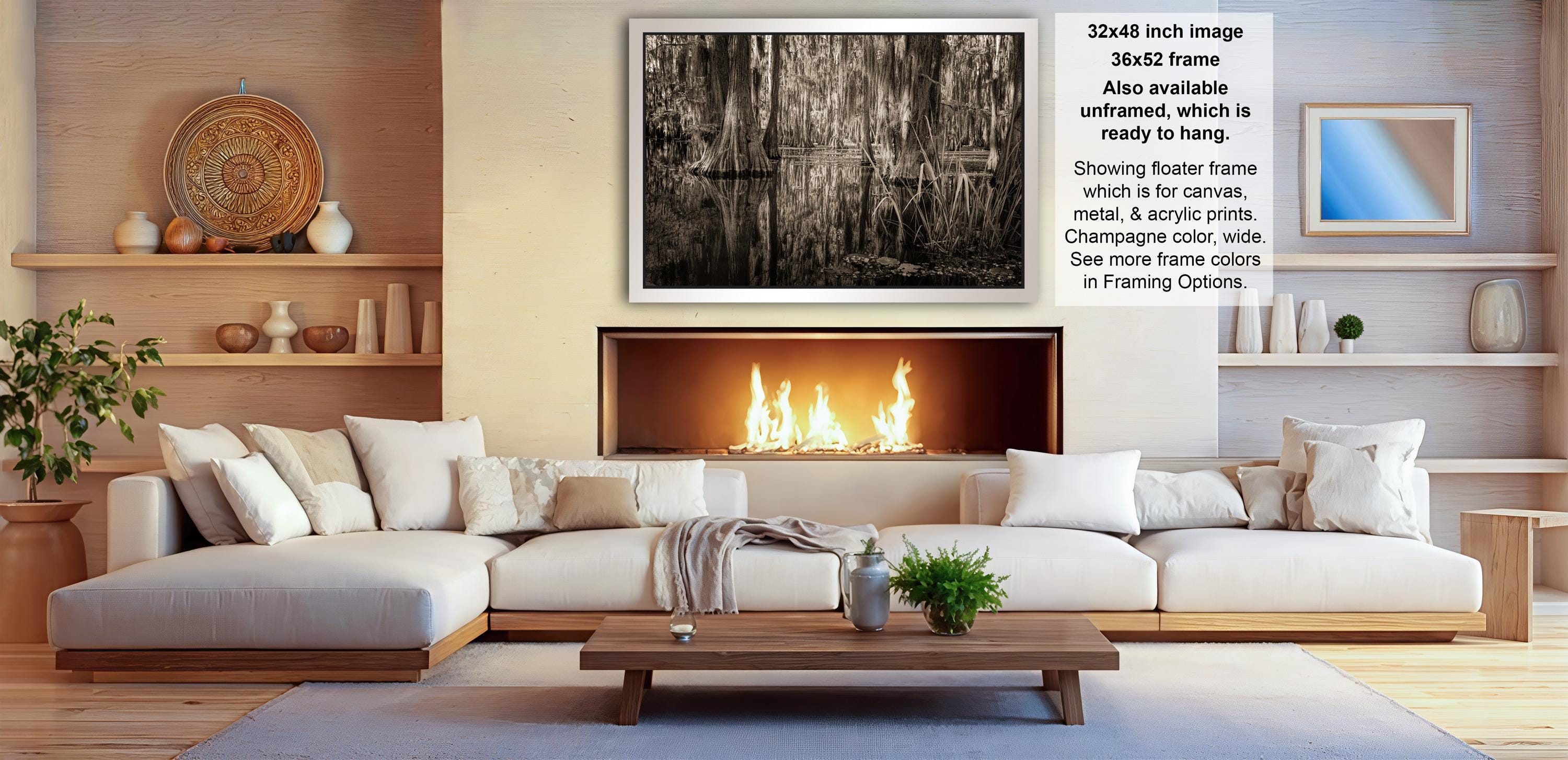 a cozy living room with a fireplace, white sofas, and various decorative elements such as vases and a potted plant.