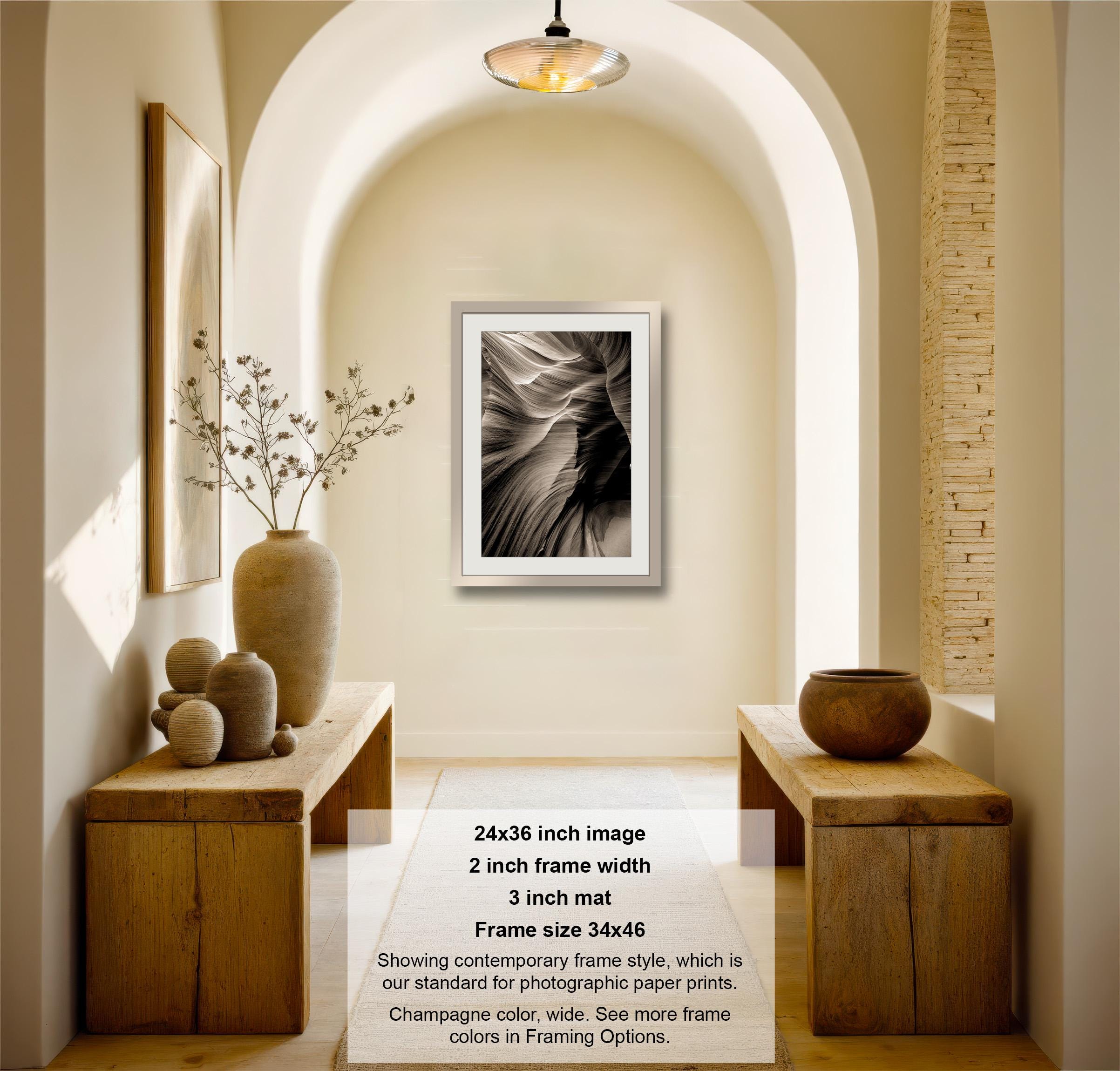 a picture hanging on the wall of a hallway