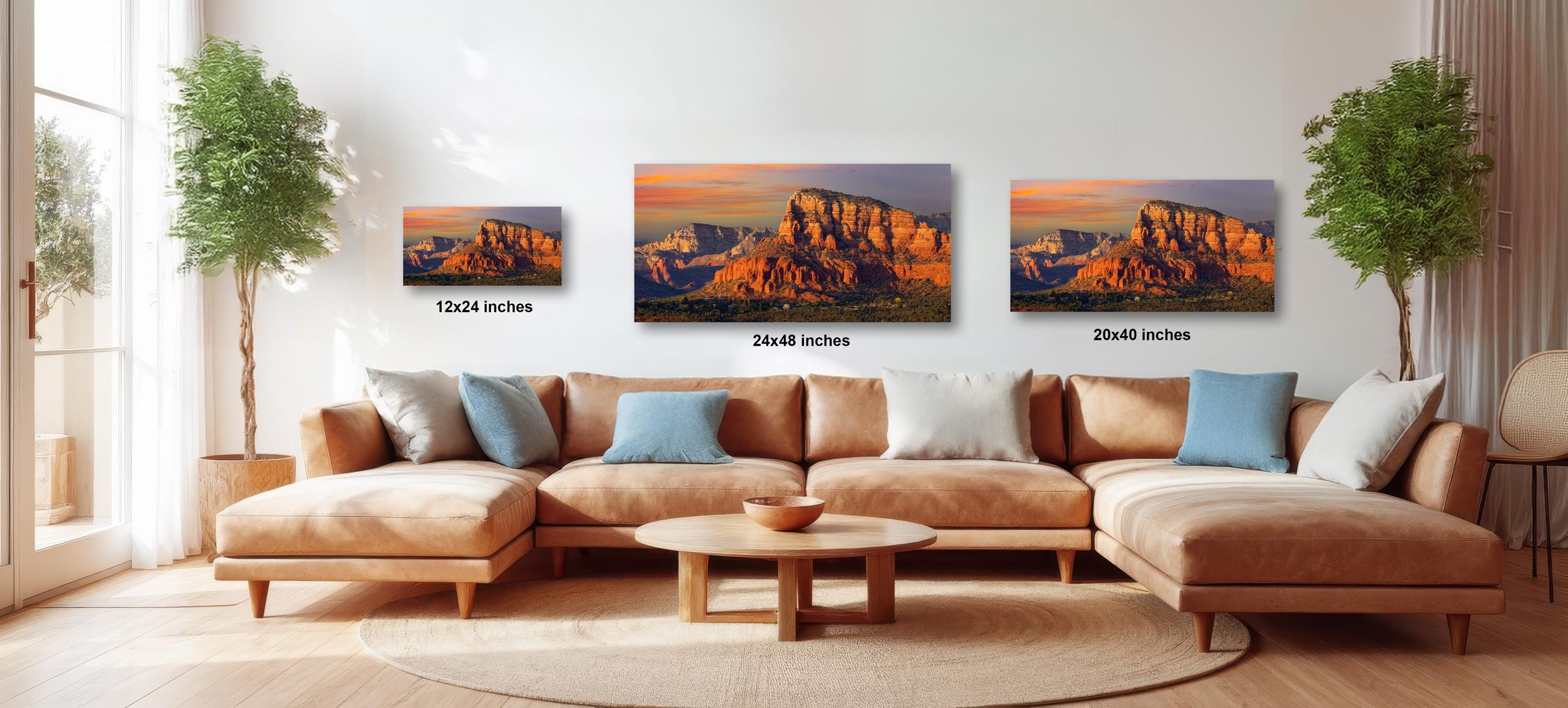 a living room with a large sectional sofa, a coffee table, and three framed landscape photographs of a desert mountain range. The photographs are of different sizes, with the largest one being 24 inches wide and the smallest one being 20 inches wide.