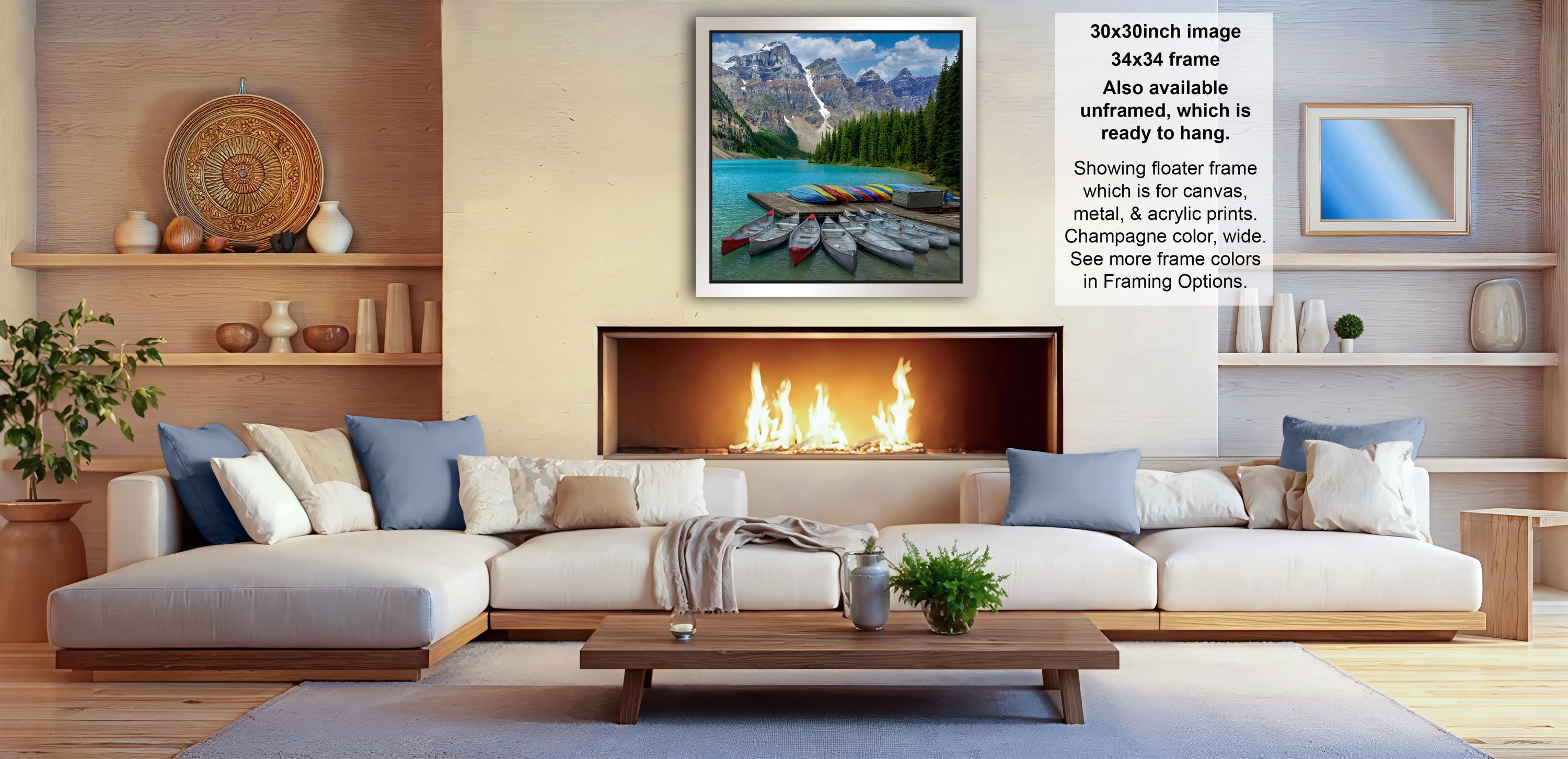 a cozy living room with a fireplace, a large white sofa, and a coffee table. The room has a warm and inviting atmosphere, with a fireplace providing a focal point and a painting of a scenic mountain landscape hanging on the wall.