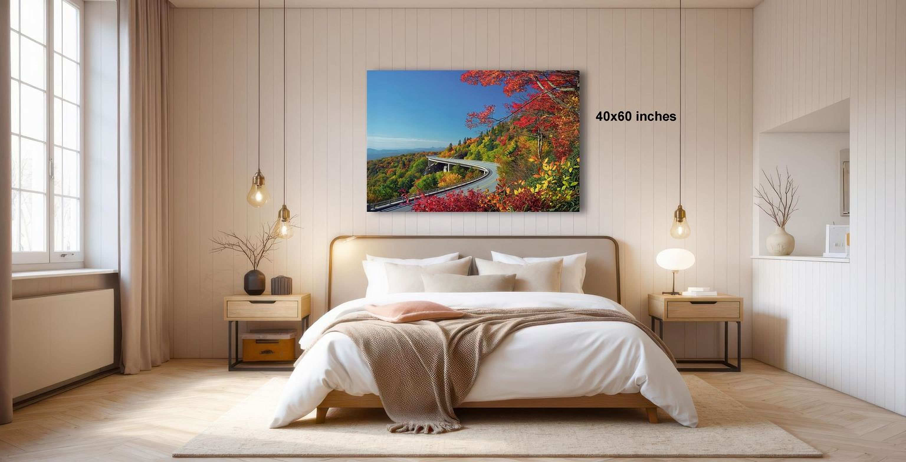 a serene bedroom with a large bed, wooden furniture, and a painting of a scenic mountain landscape hanging on the wall.
