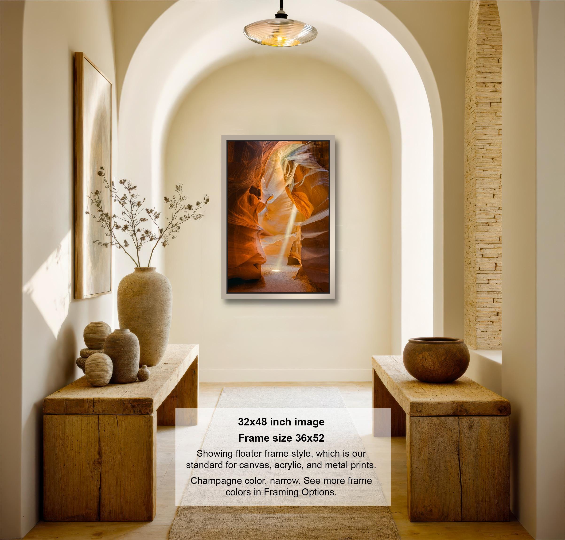 The image is a 32x48-inch framed artwork hanging on a wall in a room with wooden furniture and decorative elements such as a vase and a bowl.