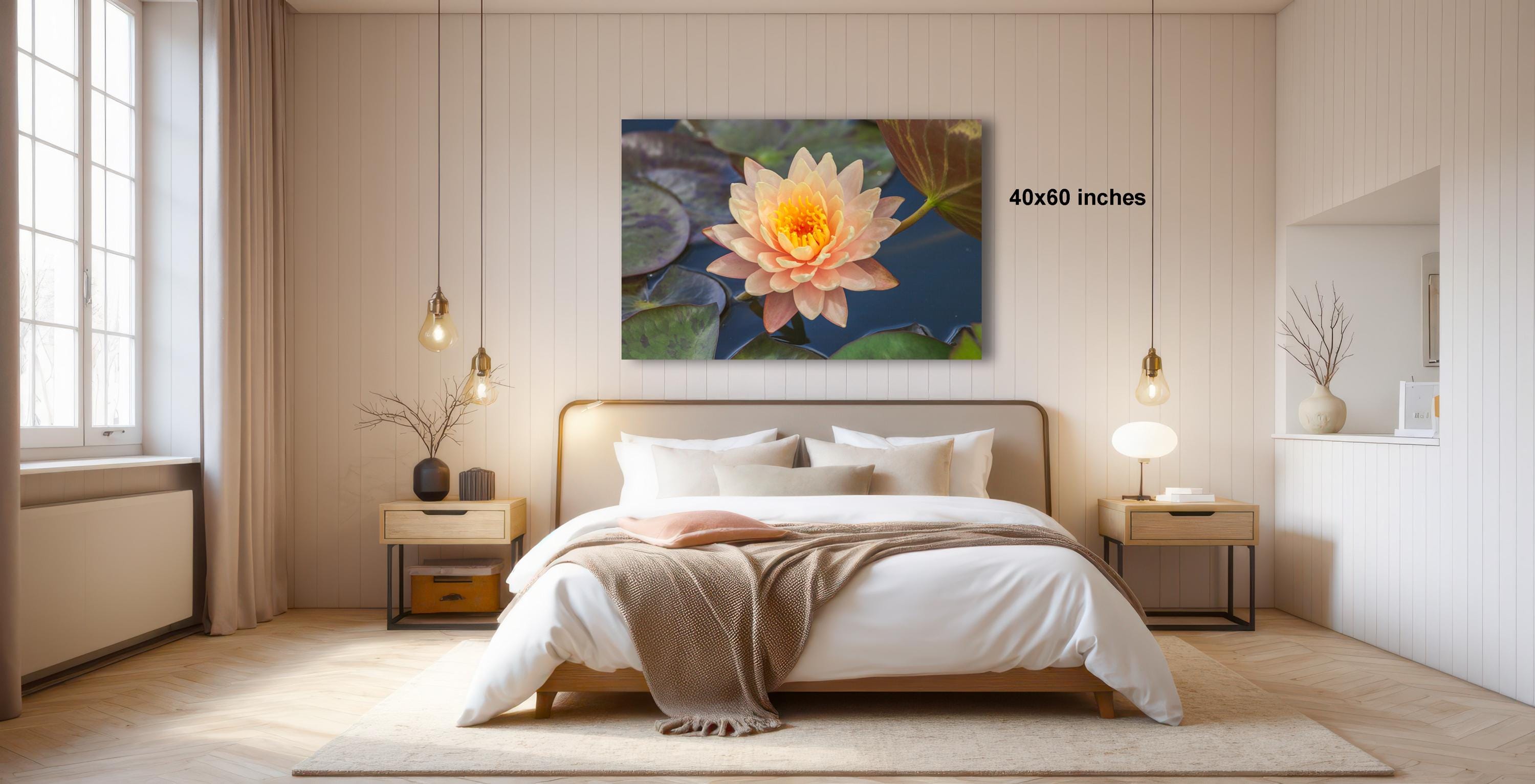 a serene bedroom with a large bed, a nightstand, and a painting of a water lily on the wall.