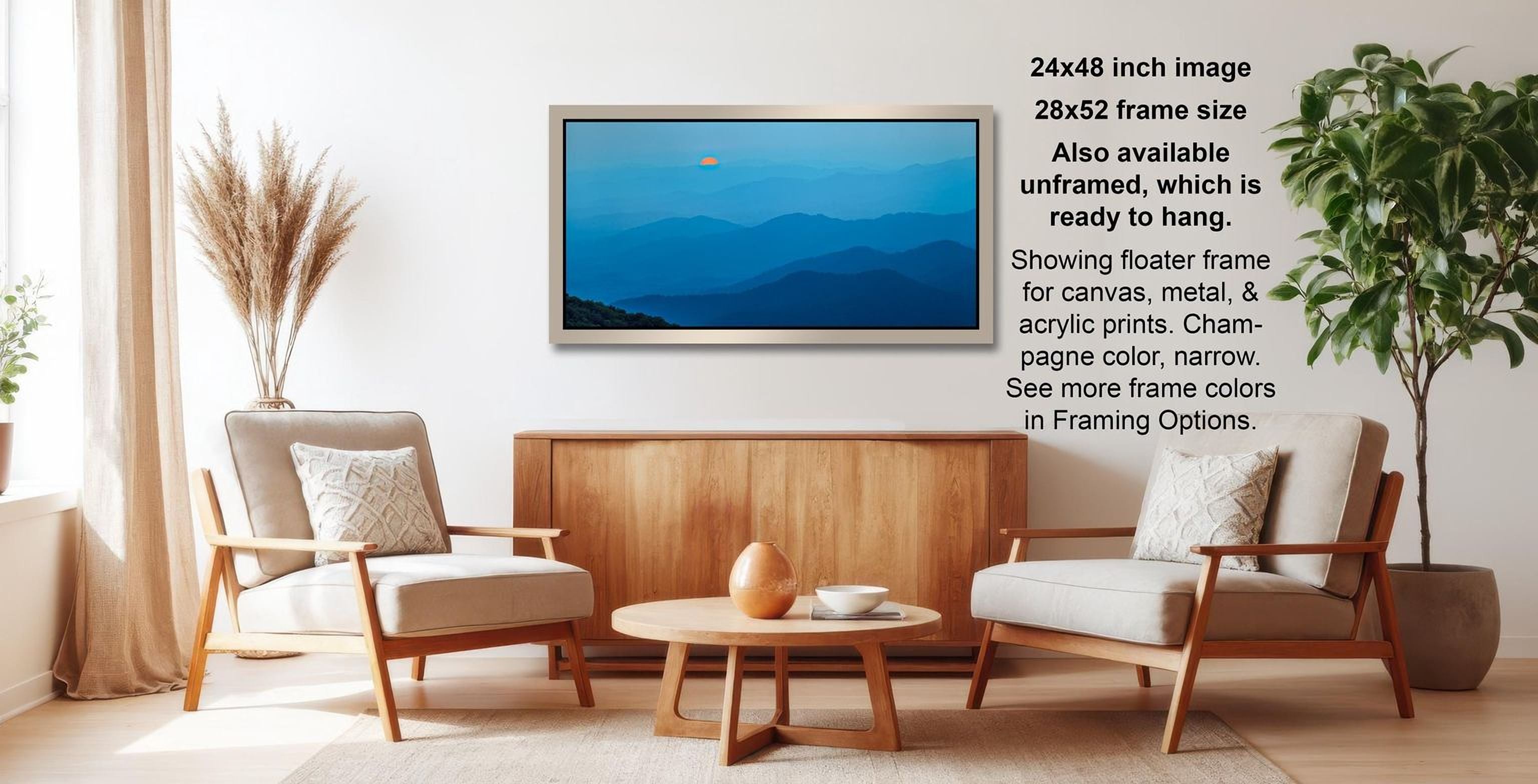 a living room with a wooden coffee table, two white armchairs, and a framed landscape painting hanging on the wall.