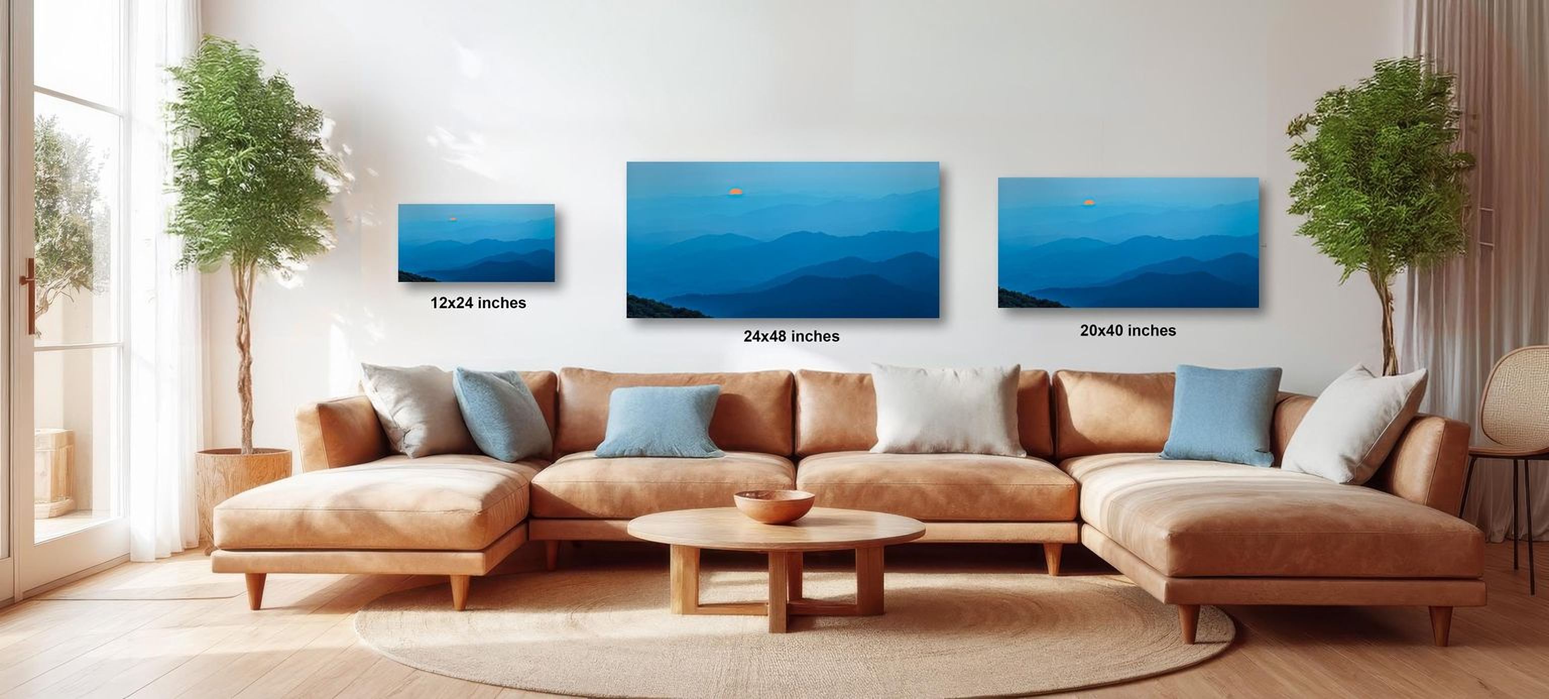 a modern living room with a large sectional sofa, a coffee table, and three framed landscape paintings hanging on the wall.