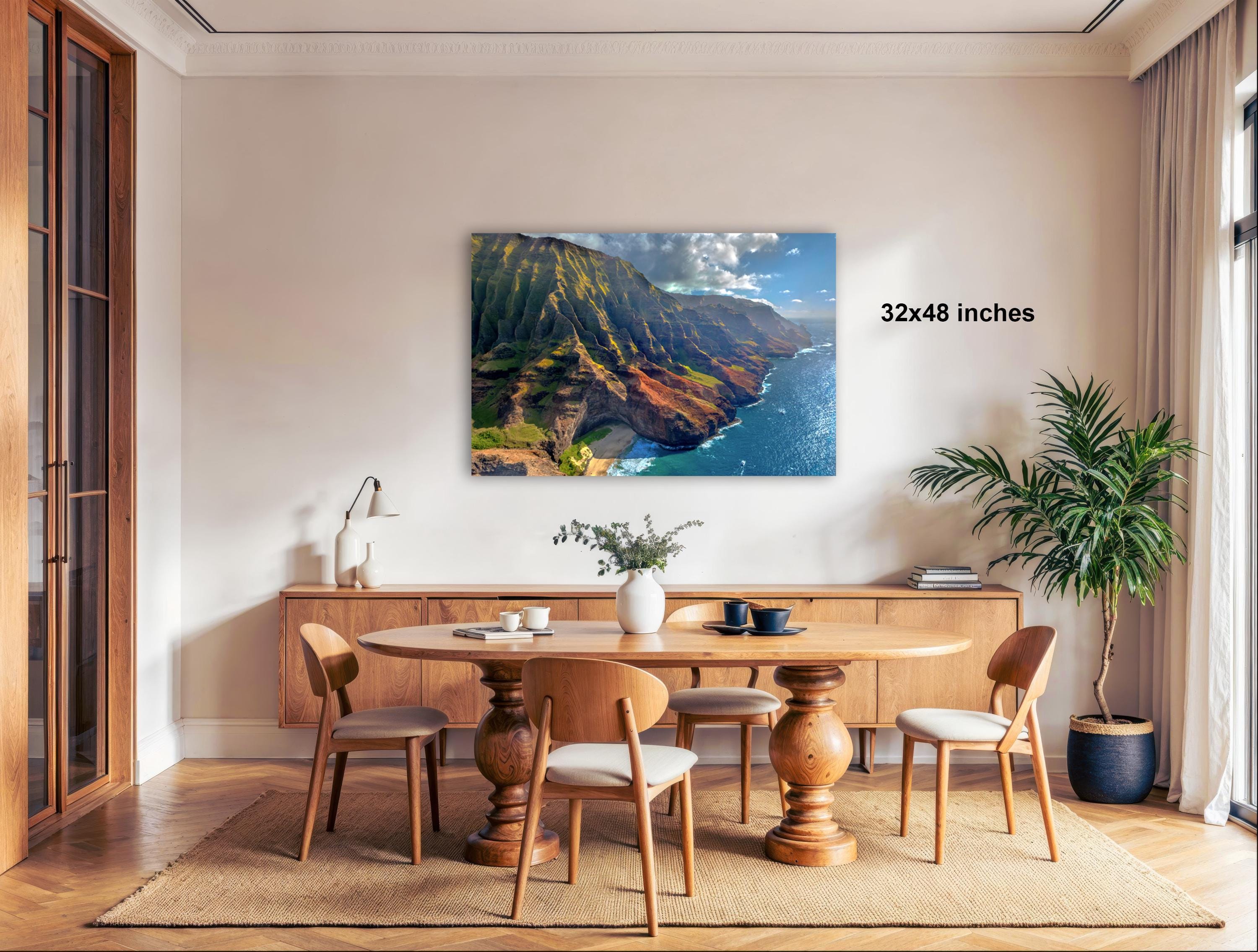a dining room with a large wooden table surrounded by chairs, a potted plant, and a large framed landscape painting hanging on the wall.