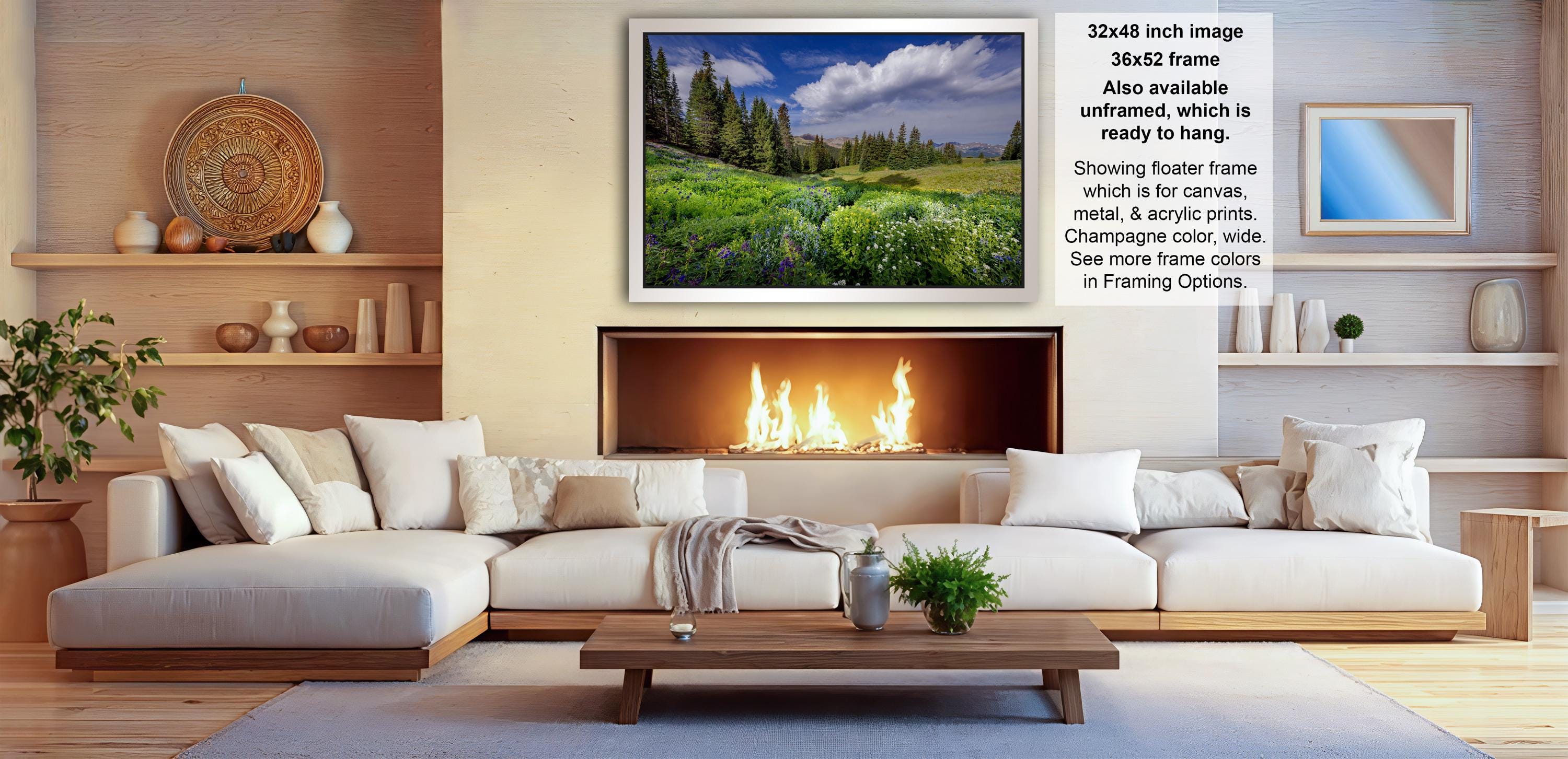 a cozy living room with a fireplace, white sofas, and various decorative elements such as vases and potted plants.