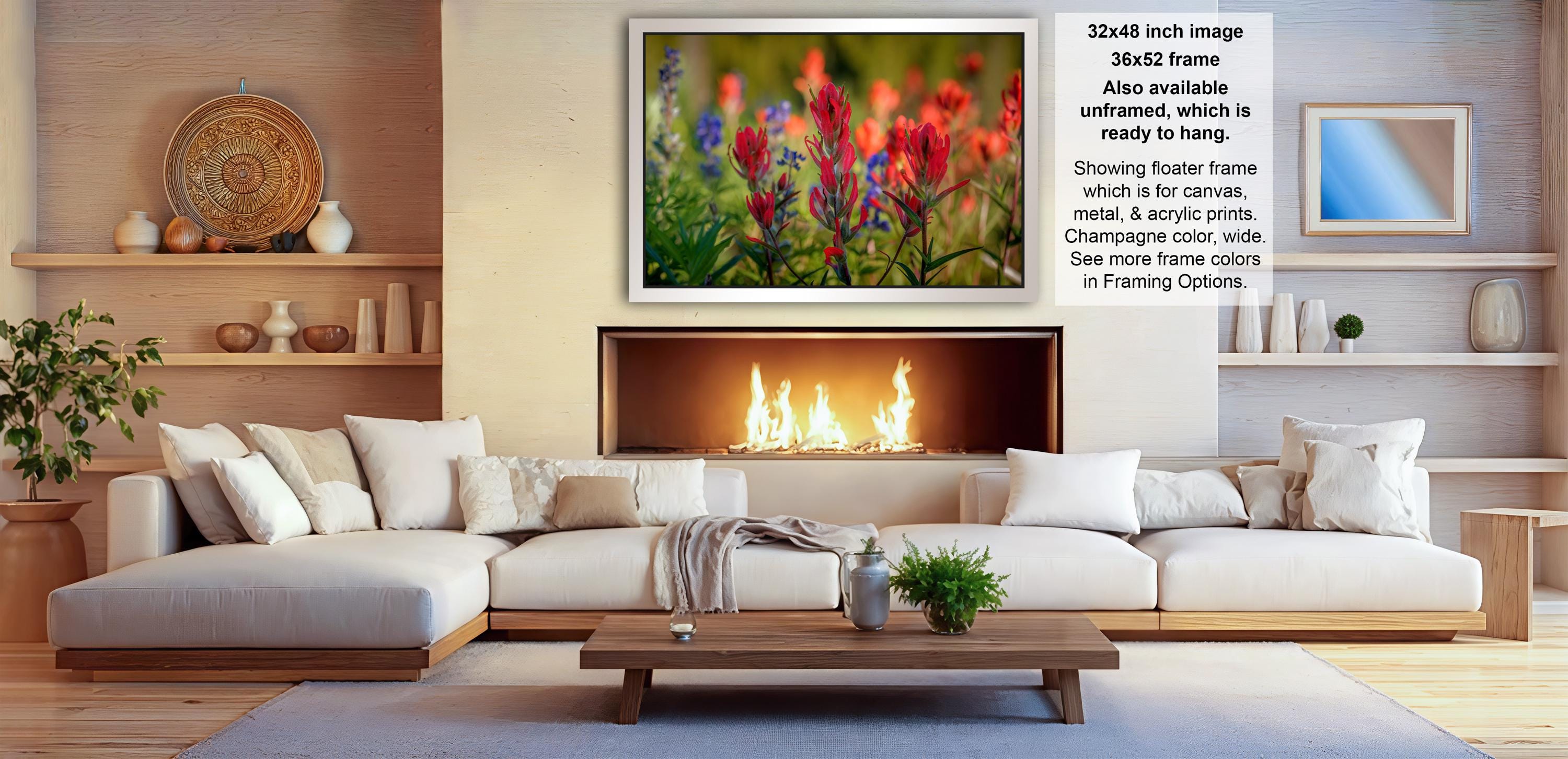 a cozy living room with a fireplace, white sofas, and various decorative elements such as vases, potted plants, and a wooden coffee table.