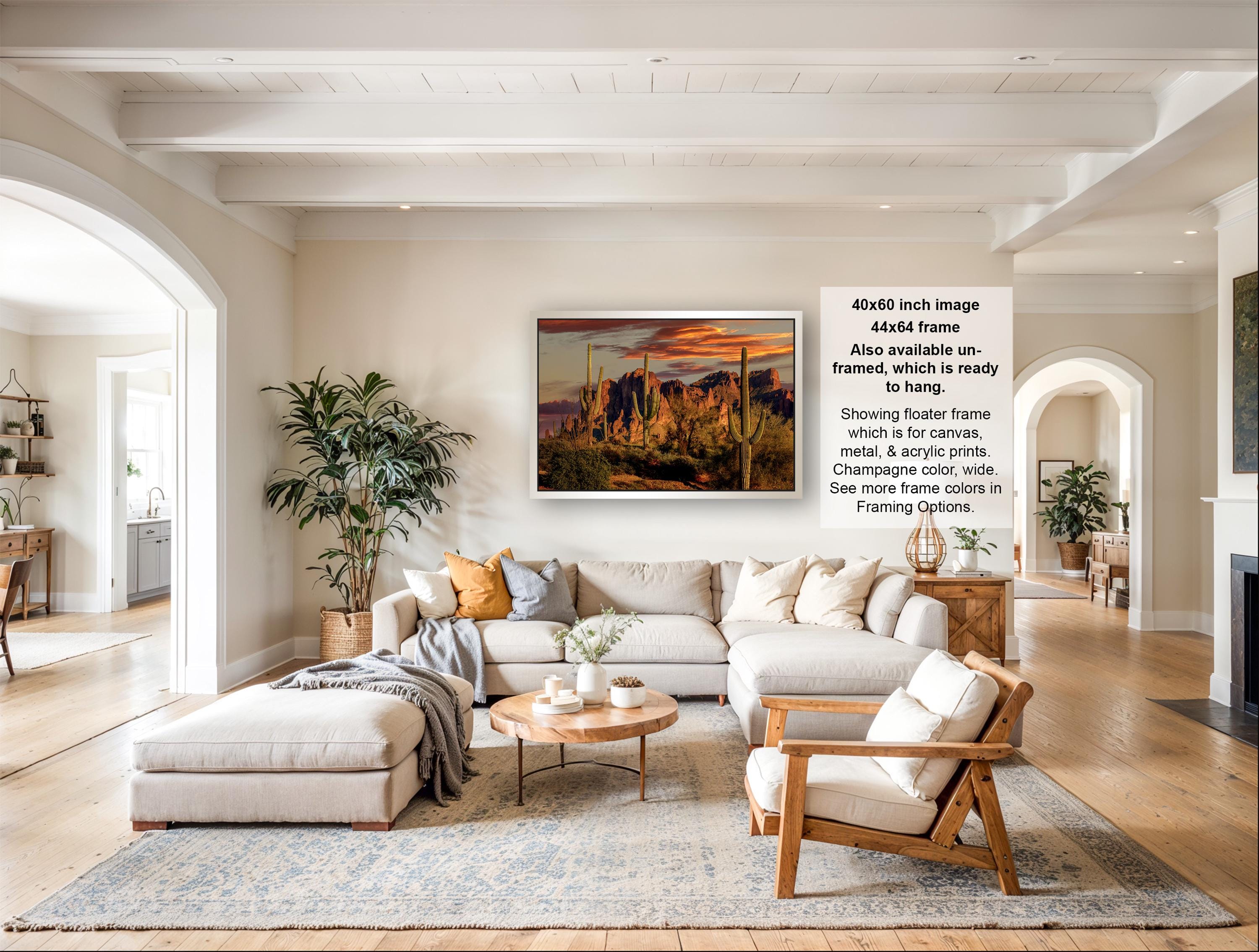 The image is a large, high-quality photograph of a living room with a large sectional sofa, a coffee table, and various decorative elements such as potted plants and vases.