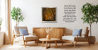 a cozy living room with two beige armchairs, a wooden coffee table, and a framed landscape photograph hanging on the wall.