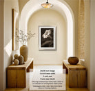 The image is a photograph of a hallway with a framed black and white image of a flower on the wall. The hallway has wooden benches and decorative vases, and the image is described as a 24x36 inch image with a 2-inch frame width and a 3-inch mat.