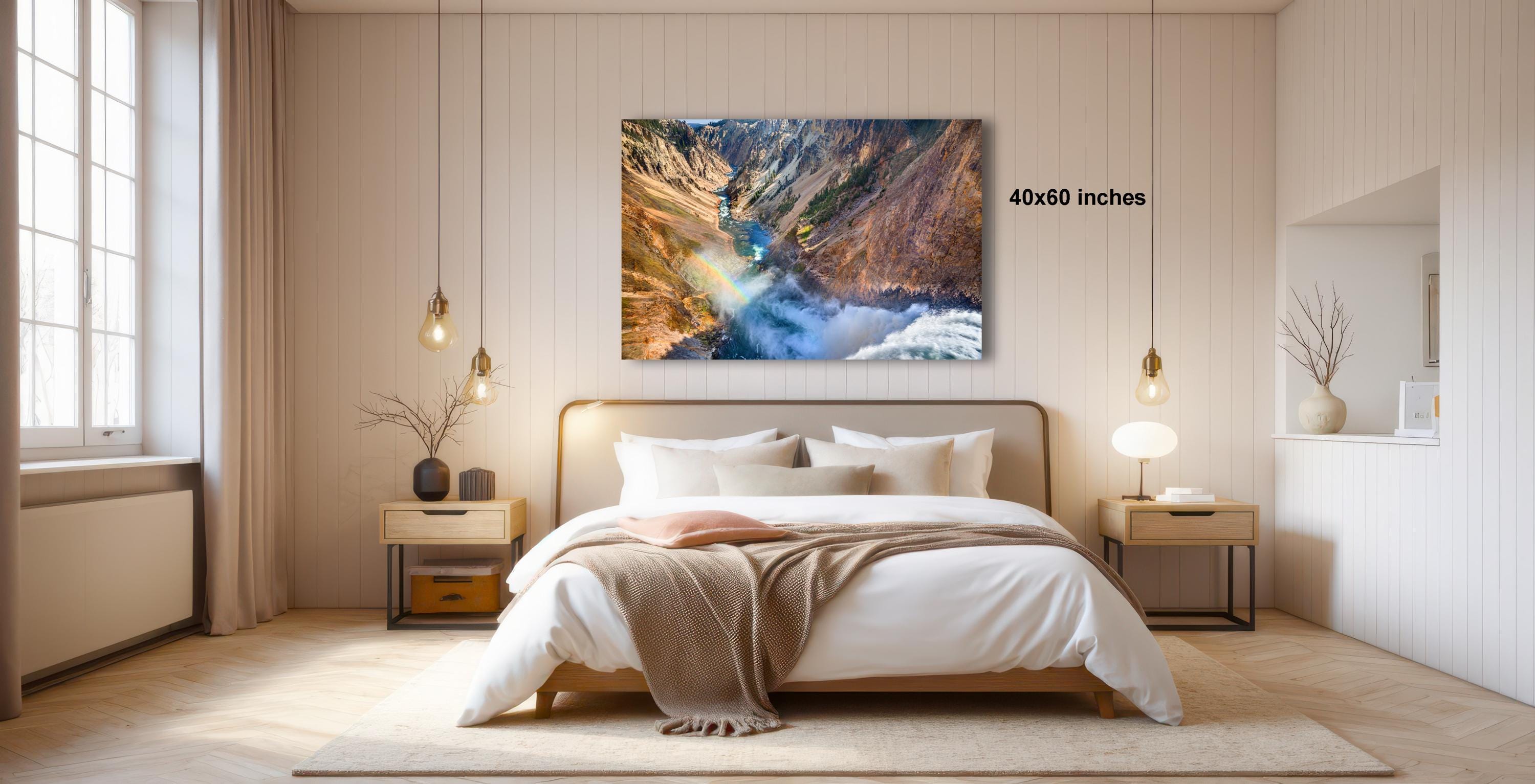 a serene bedroom with a large bed, wooden furniture, and a large window that allows natural light to fill the space. Above the bed, there is a large painting of a mountain landscape, adding a touch of nature and artistry to the room.