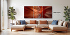 a modern living room with a large, colorful abstract painting hanging on the wall above a beige sectional sofa.