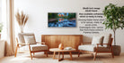 a living room with a wooden coffee table, two white armchairs, and a potted plant. A framed landscape photograph is hanging on the wall, and there is text providing information about the frame options.