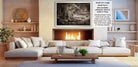 The image is a modern living room with a large white sectional sofa, a fireplace, and a wooden coffee table. The room has a warm and inviting atmosphere, with various decorative elements such as vases, potted plants, and a mirror. The focal point of the room is the fireplace, which has a fire burning, creating a cozy ambiance. The image also includes text that provides information about the frame size and material, as well as a description of the frame's design.