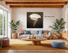 a cozy living room with a large, white flower in the center, surrounded by potted plants and a wooden coffee table.