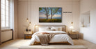 a serene bedroom scene with a large bed, wooden furniture, and a painting of trees on the wall.