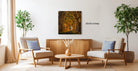 a cozy living room with a wooden coffee table, two armchairs, and a potted plant. A framed photograph of a tree-lined path is hanging on the wall, adding a natural element to the space.