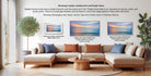 a living room with a large sofa and a coffee table, along with three framed prints displayed on the wall. The framed prints have different frame styles, including a matted print and a floater frame.