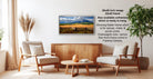 a living room with a wooden coffee table, two white armchairs, and a potted plant. A framed landscape photograph is hanging on the wall, and there is text providing information about the frame options.