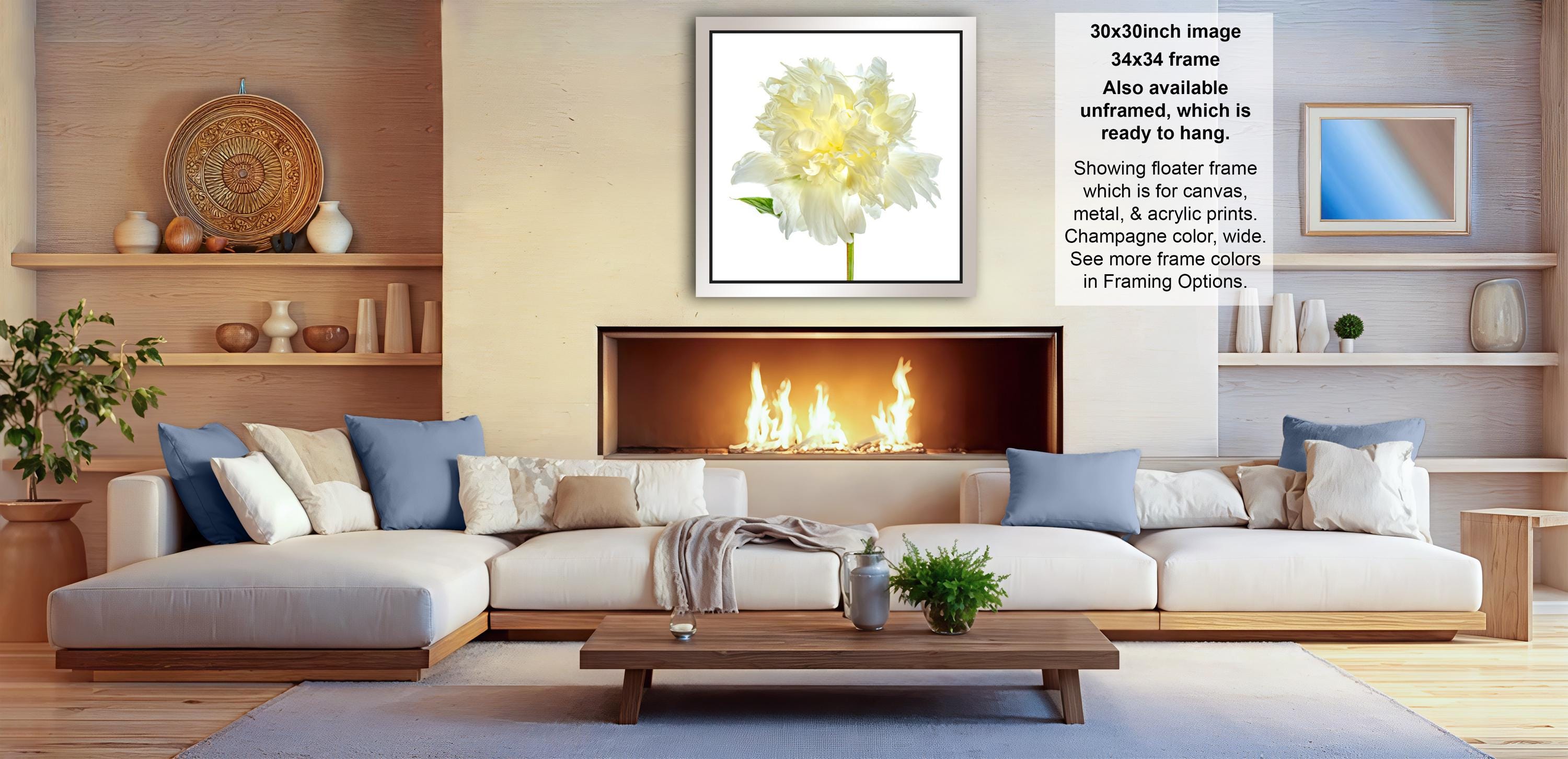 a cozy living room with a fireplace, white sofas, and various decorative elements such as vases, potted plants, and a wooden coffee table.