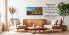 a living room with a wooden coffee table, two white armchairs, and a potted plant. A framed landscape photograph is hanging on the wall, and there is text providing information about the frame options.