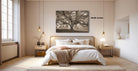 a serene bedroom with a large bed, wooden furniture, and a large window that allows natural light to fill the space. Above the bed, there is a framed photograph of a tree, adding a touch of nature to the room. The room has a minimalist and modern design, with a neutral color palette and clean lines.