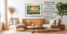 a living room with a wooden coffee table, two white armchairs, and a framed photograph of a pink lotus flower hanging on the wall.