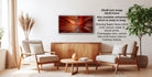 The image is a modern living room with a wooden coffee table, two white armchairs, and a wooden sideboard. Above the coffee table is a framed photograph of a red and orange abstract design.