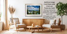 a cozy living room with a wooden coffee table, two beige armchairs, and a framed landscape photograph hanging on the wall.