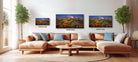 The image is a modern living room with a large sectional sofa, a coffee table, and three framed landscape photographs hanging on the wall.
