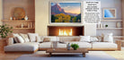 a cozy living room with a fireplace, white sofas, and a wooden coffee table. The room has a warm and inviting atmosphere, with a fireplace providing a focal point and a painting of a mountain landscape hanging above it.