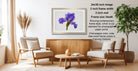 a living room with a wooden coffee table, two white armchairs, and a framed photograph of a purple iris flower hanging on the wall.