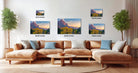 a large, brown sectional sofa with multiple pillows, a wooden coffee table, and a potted plant in the background. Above the sofa, there are three framed landscape photographs of mountains, each with a different size and resolution.