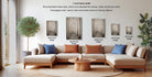 a living room with a large sectional sofa, a coffee table, and various framed artworks displayed on the wall.