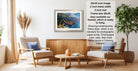 a living room with a wooden coffee table, two white armchairs, and a framed picture of a mountain landscape hanging on the wall.