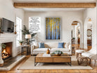a cozy living room with a fireplace, a large window, a comfortable sofa, a coffee table, and a television.