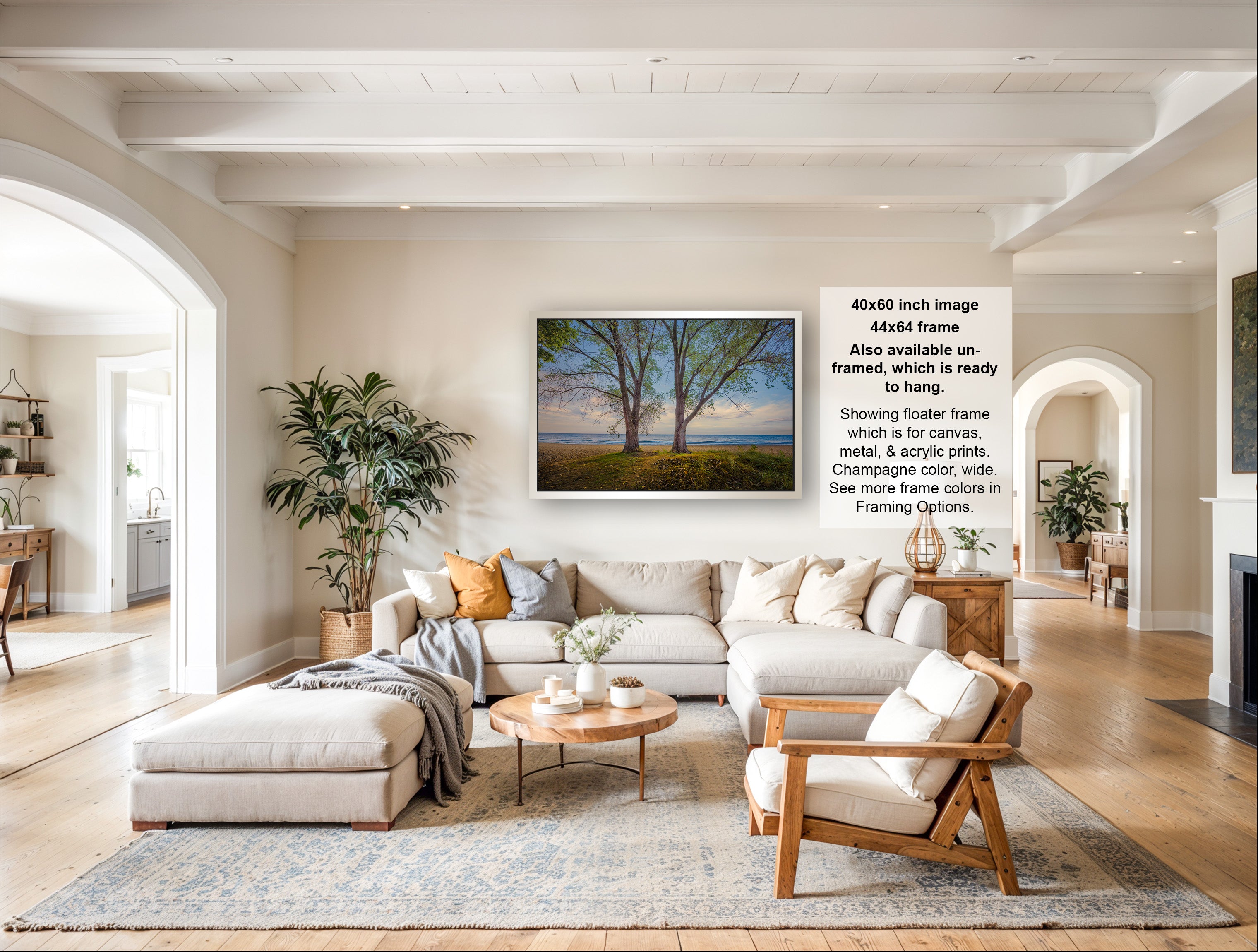 a spacious living room with a large sectional sofa, a coffee table, and a fireplace. The room is decorated with various plants and has a neutral color palette.