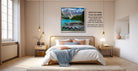 a serene bedroom scene with a large bed, wooden furniture, and a framed picture of a mountain landscape hanging on the wall.