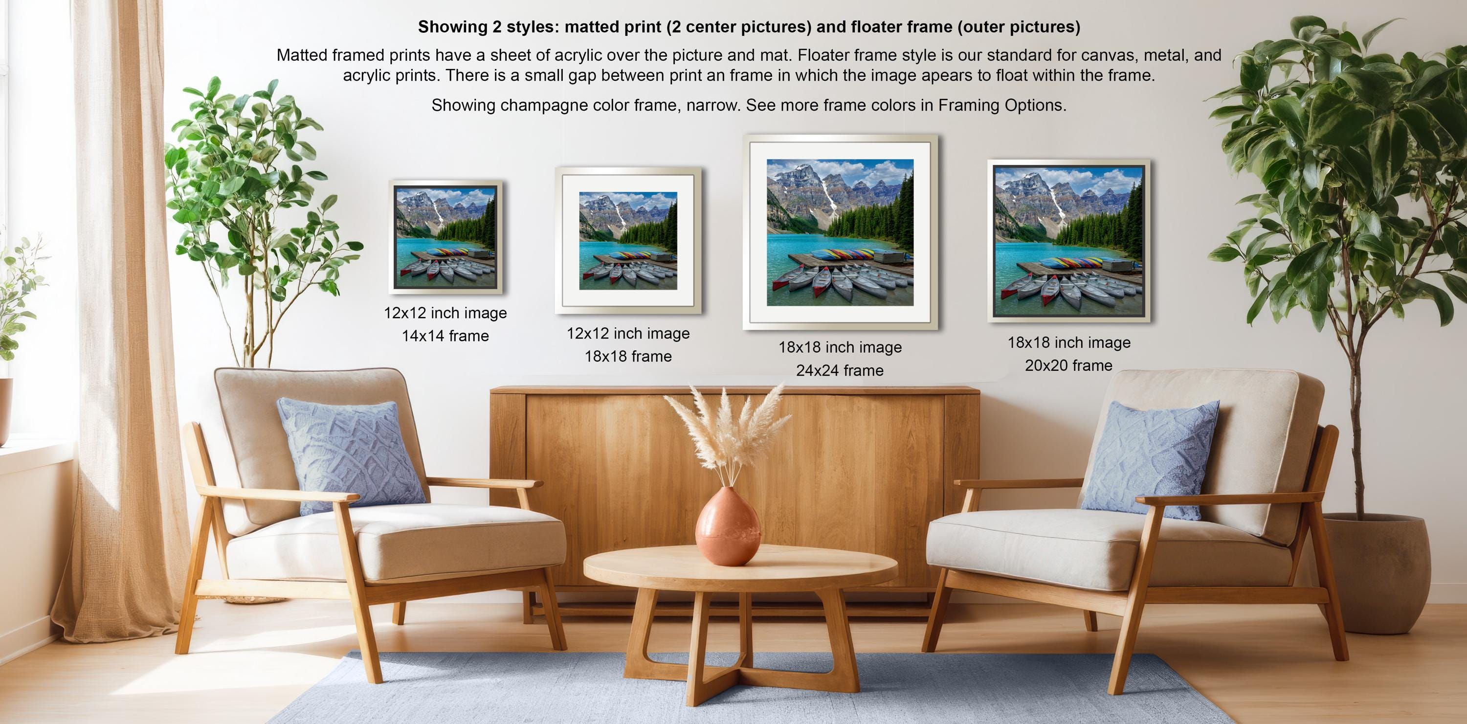 a living room with three framed pictures of a scenic mountain landscape, including a lake with boats, displayed on the wall. The room has two chairs and a coffee table, creating a cozy and inviting atmosphere.