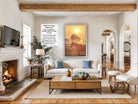 a cozy living room with a fireplace, a large window, a comfortable sofa, a coffee table, and a painting of a horse in a field.