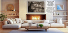 a cozy living room with a fireplace, white sofas, and various decorative elements such as vases and a potted plant.