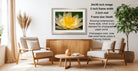 a living room with a wooden coffee table, two white armchairs, and a framed photograph of a yellow flower on the wall.