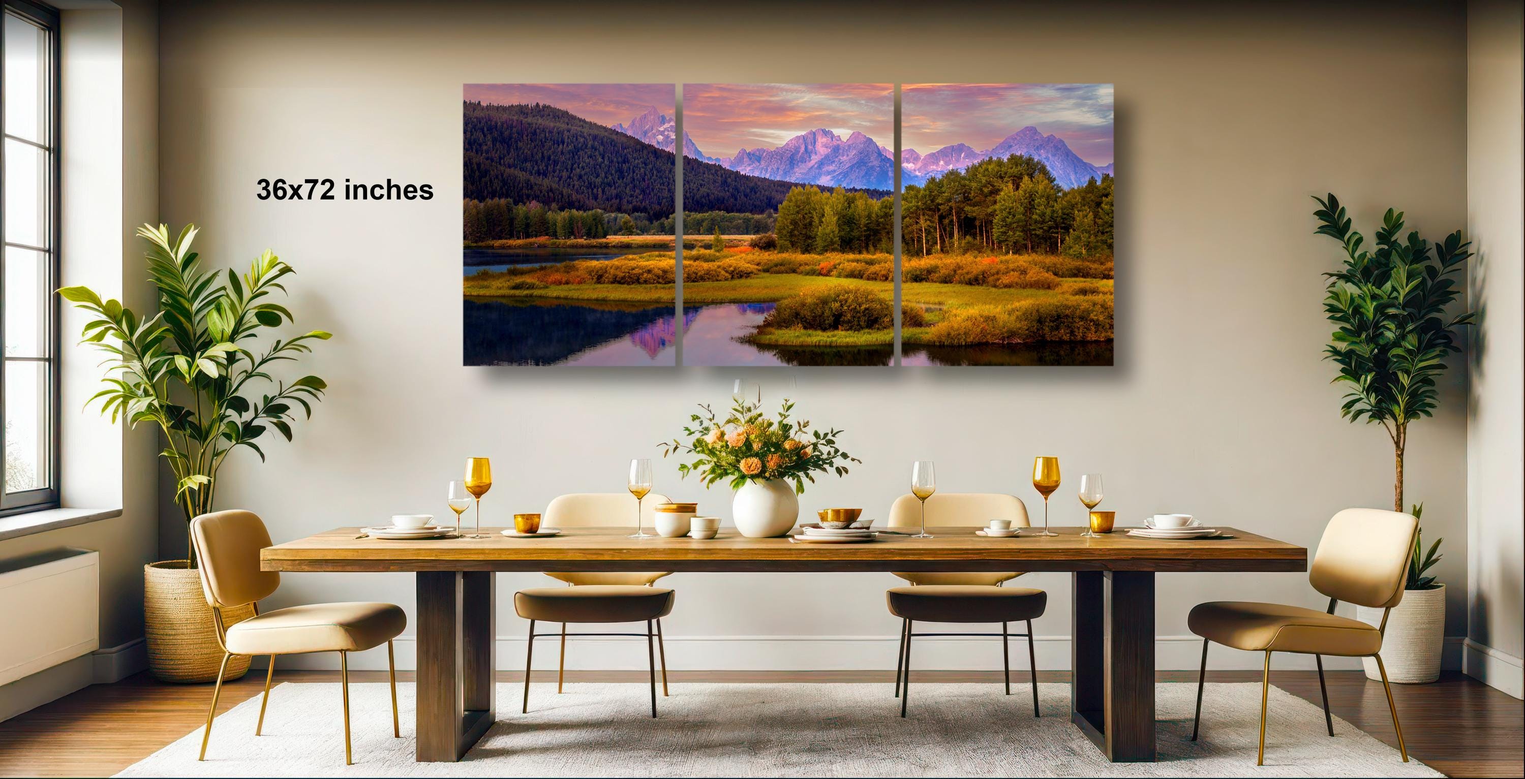 a large, three-panel landscape painting hanging on a wall above a wooden dining table set with wine glasses, plates, and a vase of flowers.
