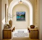 A framed photograph of a scenic mountain landscape with boats on a lake is displayed on the wall in a room with wooden furniture and decorative items.