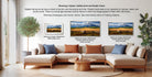 The image is a living room with a large couch and a coffee table, along with a potted plant and a framed print of a landscape. The couch is arranged in a semi-circle around the coffee table, creating a cozy and inviting atmosphere. The framed print is displayed on the wall, showcasing different frame styles and sizes, including a matured print and a floater frame.