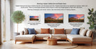 a living room with a large sofa and a coffee table, along with a potted plant and a framed print of a sunset landscape. The sofa is arranged in a semi-circle around the coffee table, creating a cozy and inviting atmosphere. The framed print is displayed on the wall, showcasing the beauty of the sunset and the surrounding environment.