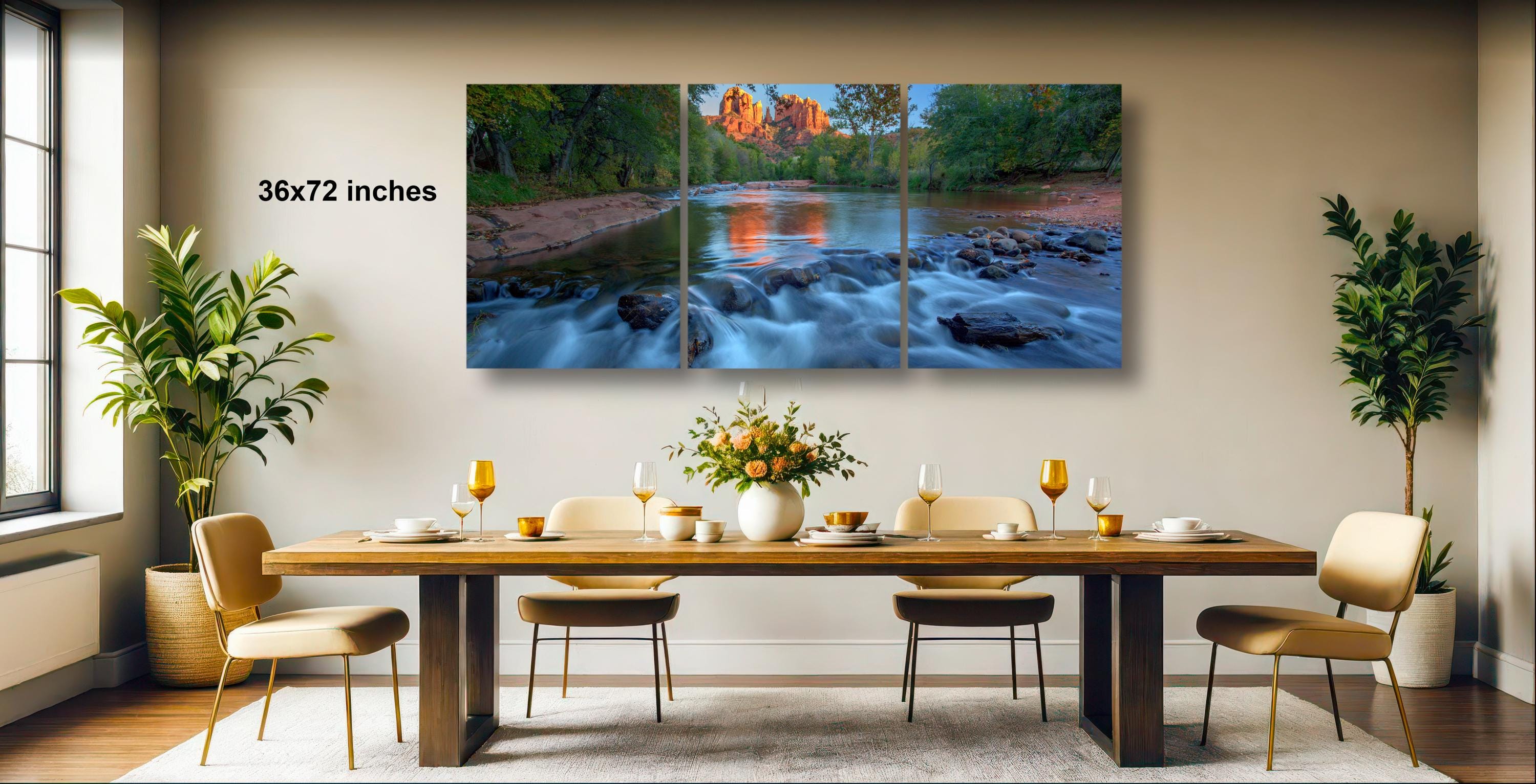 a modern dining room with a large, high-quality, three-panel landscape painting of a river flowing through a forest. The painting is hung on the wall above a wooden dining table set with wine glasses, plates, and a vase of flowers. The room is decorated with potted plants and has a neutral color scheme, creating a serene and elegant atmosphere.