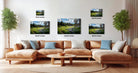 The image is a modern living room with a large sectional sofa, a coffee table, and several potted plants. The wall is decorated with three framed landscape paintings, each varying in size and depicting different scenes.