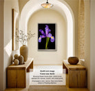 The image is a 32x48-inch framed photograph of a purple iris flower, hanging on a wall in a room with wooden furniture and decorative elements.
